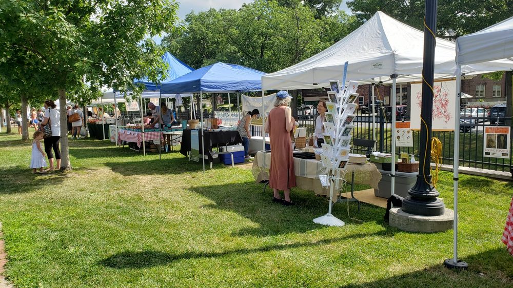 Vendors and neighbors gather at the local Pawling farmers market on the village green.